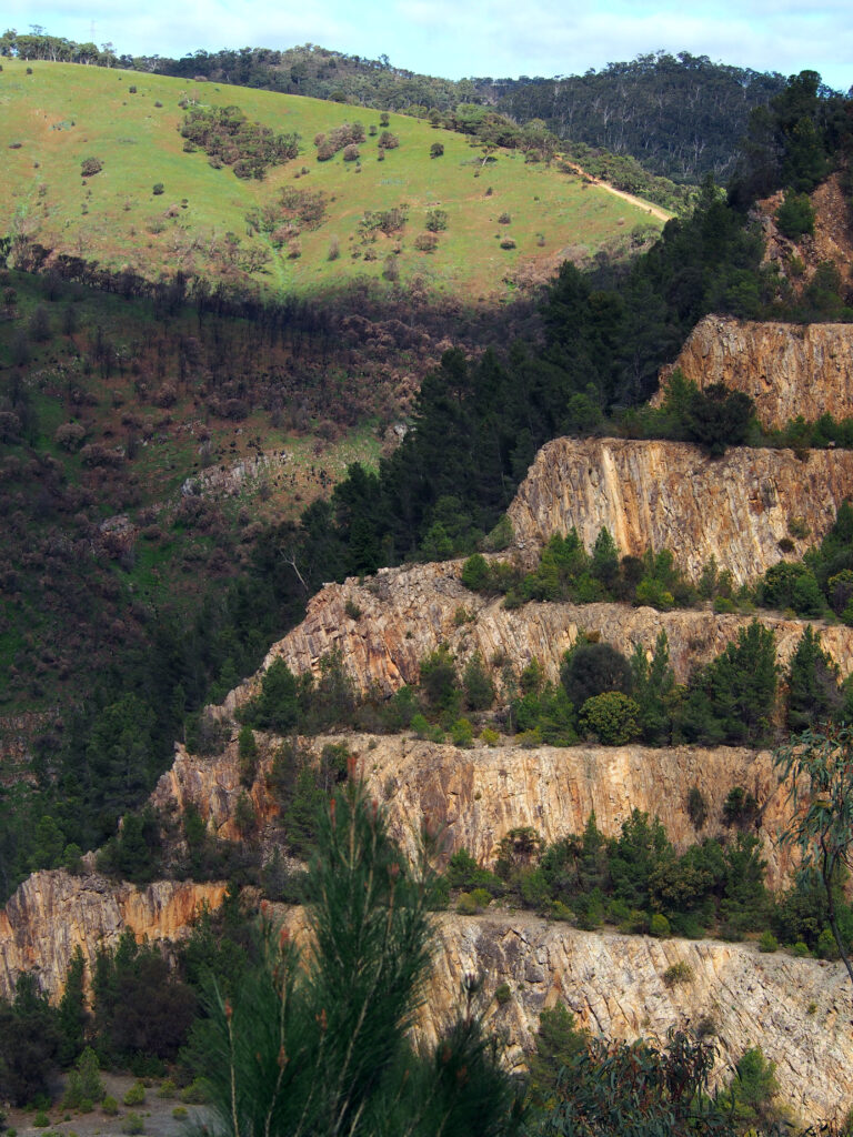 Quarry at Highbury composed diagonally with Black Hill Conservation Park and the Main Ridge Track in the background